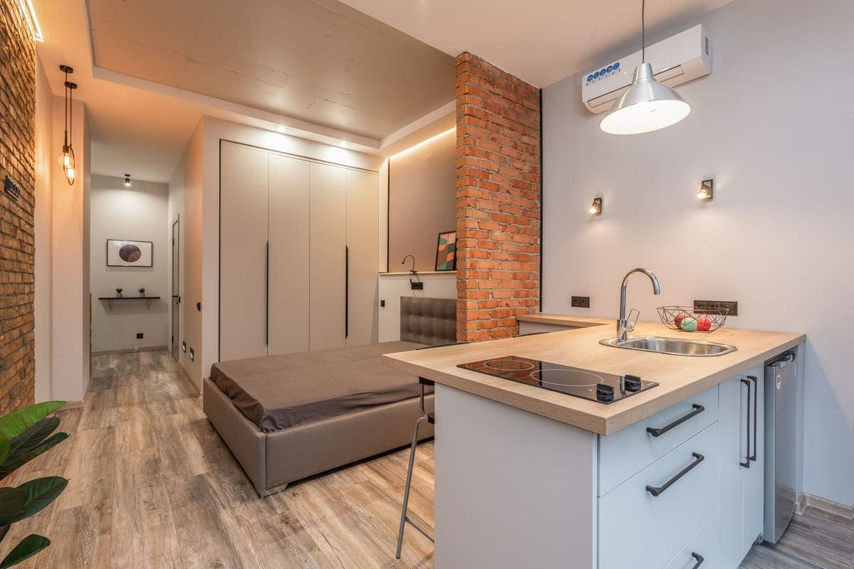 Compact apartment kitchen with a small sink and base cabinet