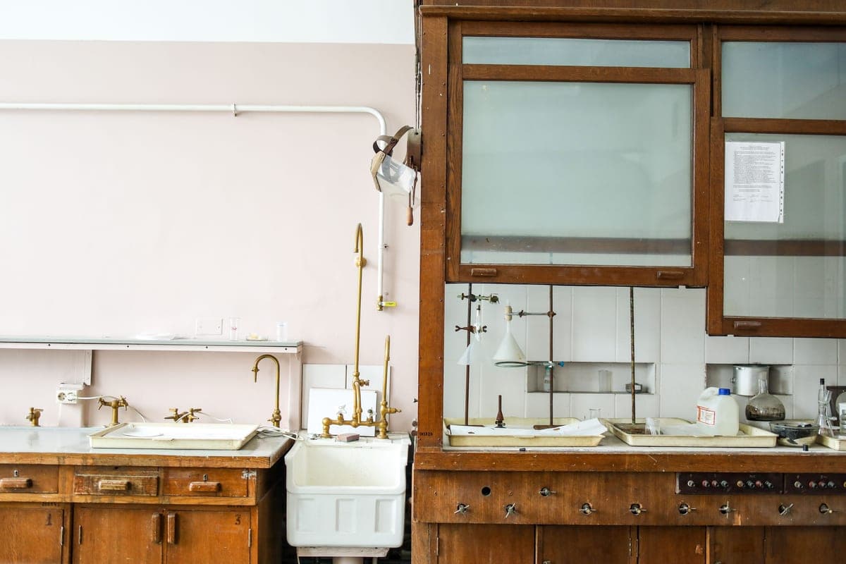 Disposal and drain plumbing inside a cabinet under a sink