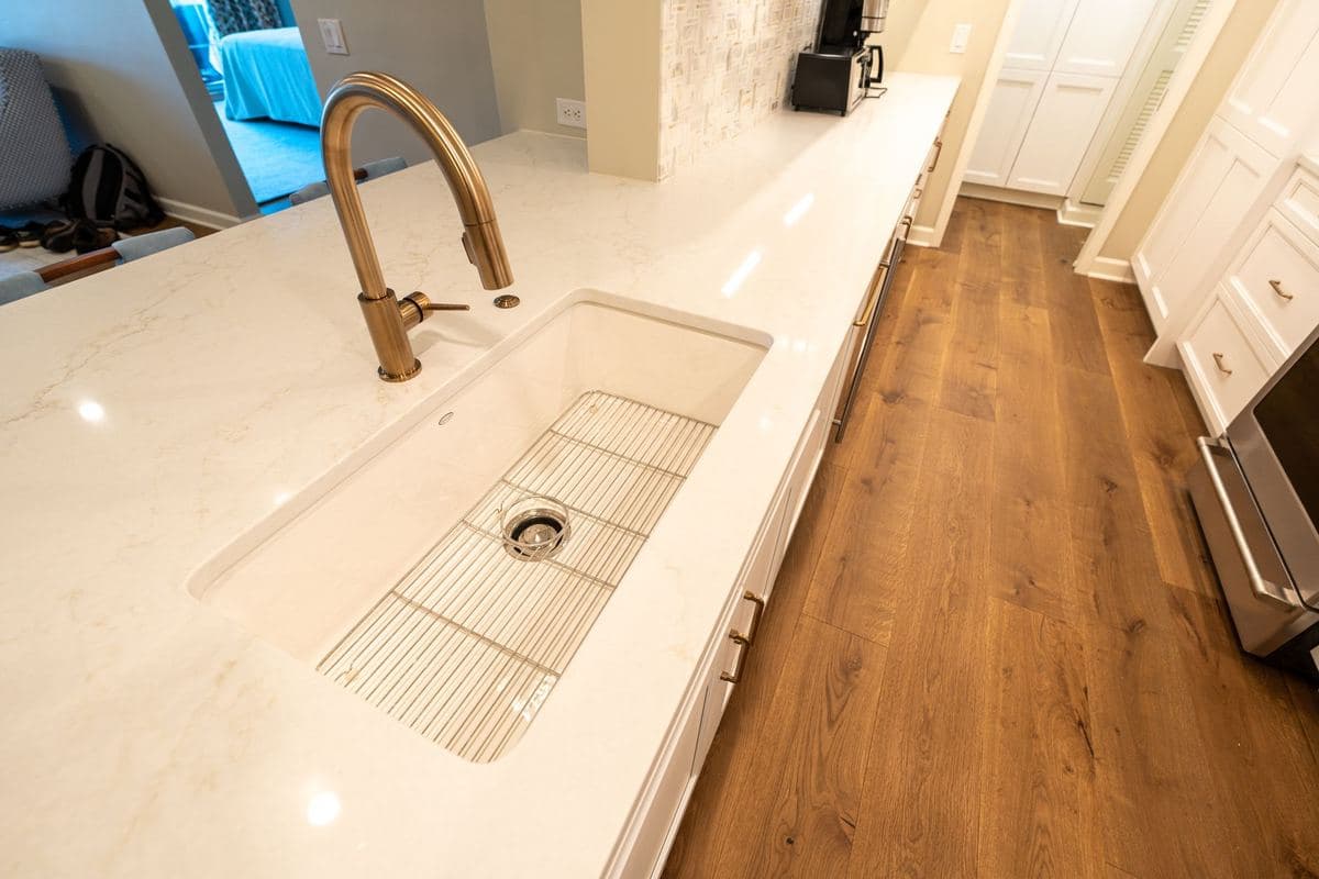 Modern kitchen with a stone countertop and sink fixtures