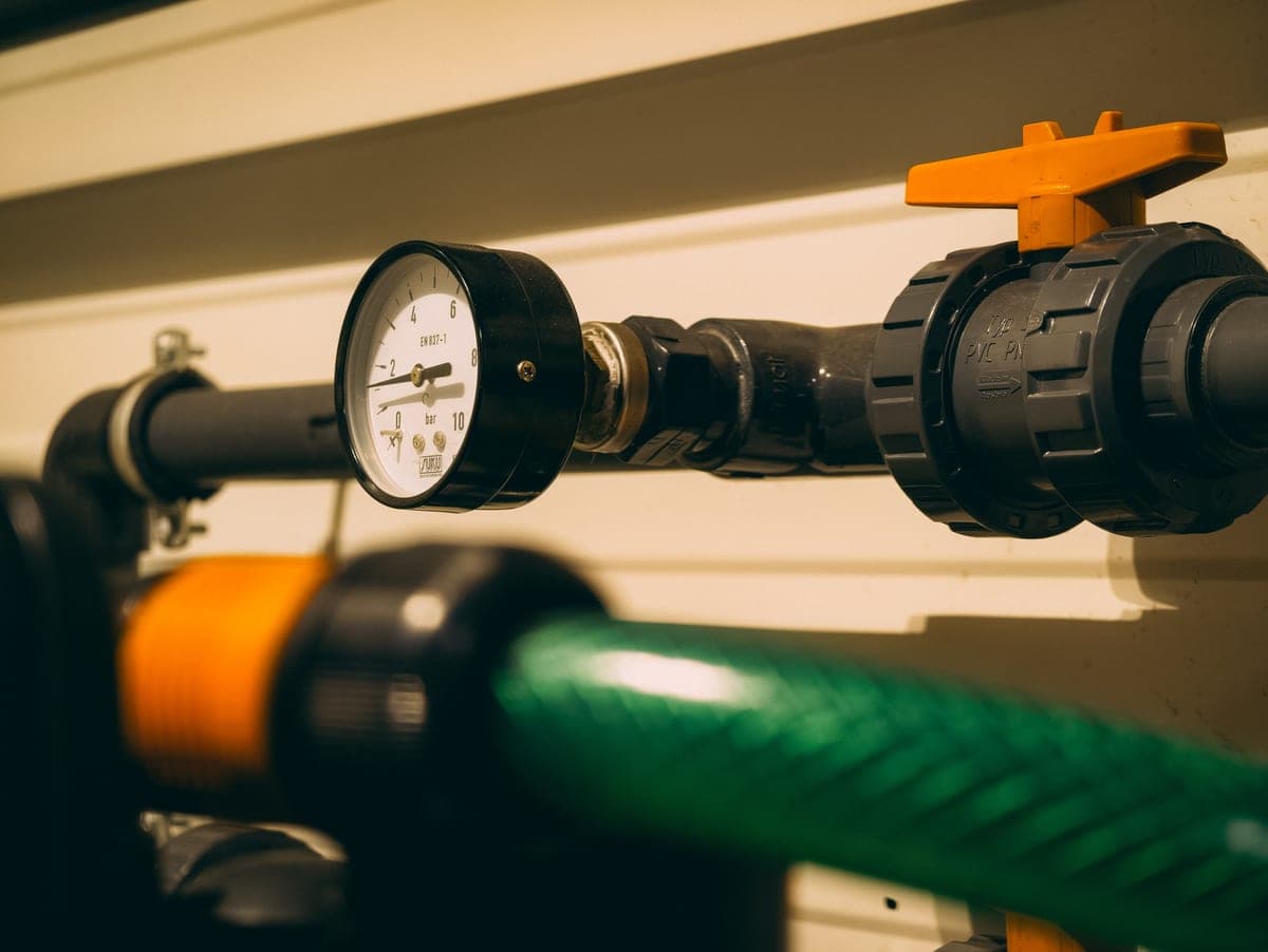 Faucet cartridge and valve components laid out on a work surface