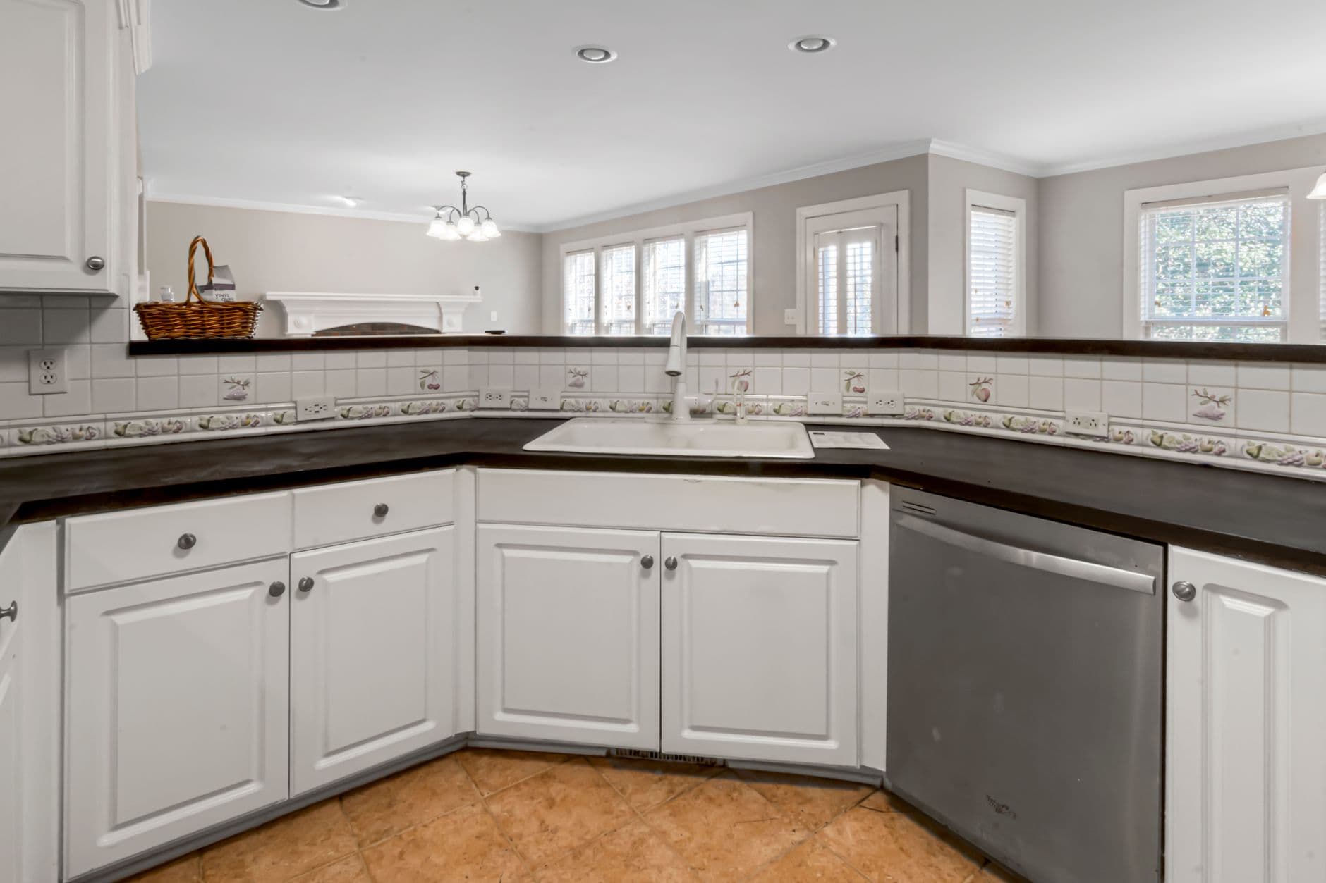 Contemporary kitchen corner with stone countertops meeting at a right angle