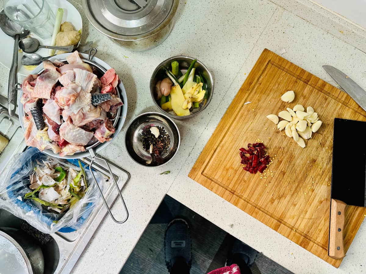 Vegetable scraps and peelings on a chopping board