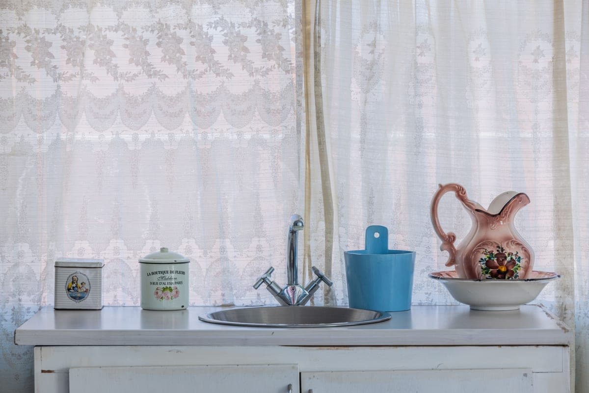 White ceramic kitchen sink in a bright kitchen